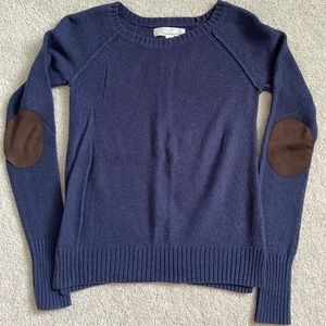 Blue Sweater with brown elbow patches.